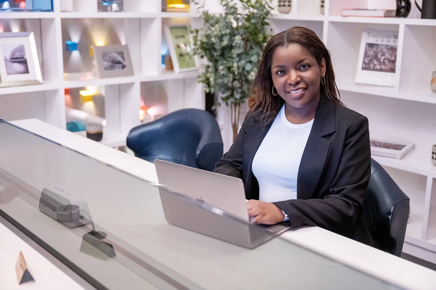 Toni Martin, founder of Fortivise, working at a laptop